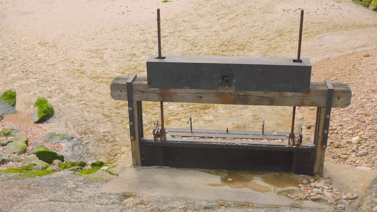 Old Sluice Gate Controlling Water Flow in a River