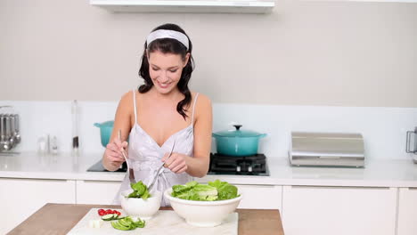 beautiful brunette serving up a healthy salad