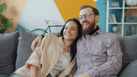 happy couple relaxing on a sofa