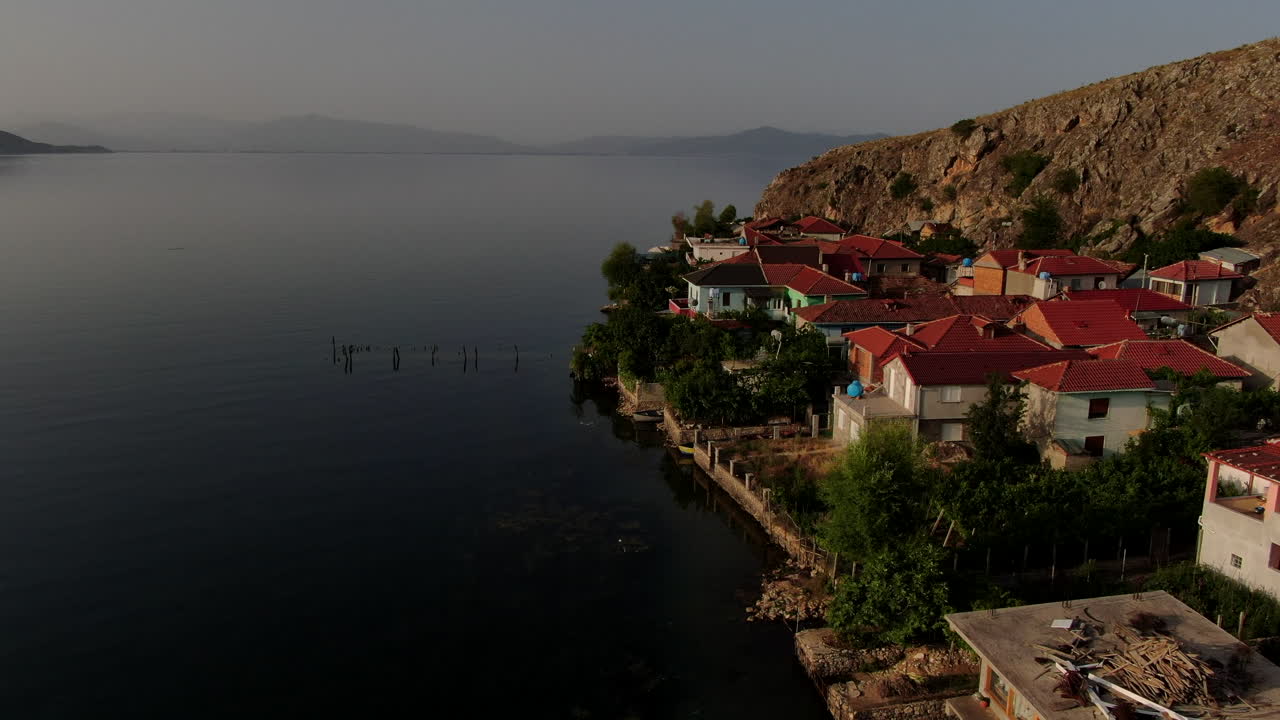 Beautiful picturesque European homes in Pogradec, a waterfront view of Lake Ohrid. Aerial view