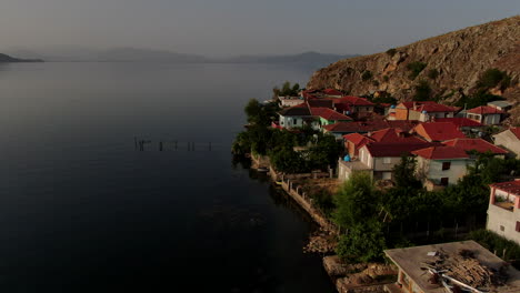 beautiful picturesque european homes in pogradec, a waterfront view of lake ohrid. aerial view