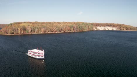 au sable river queen boat on the au sable river in michigan with drone video flying sideways