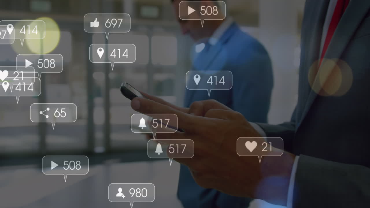 Animation of social media icons over mid section of businessman using smartphone at office