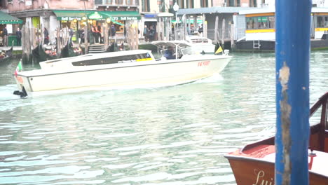 a boat crossing a canal in venice