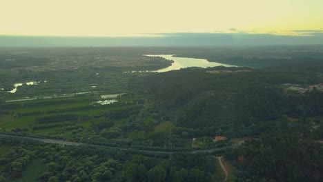 Sunset-over-a-river-flowing-through-a-forest