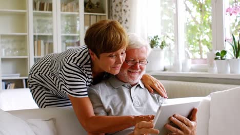 senior couple using digital tablet