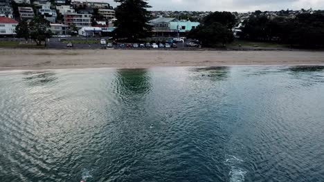 Group-of-people-swimming-along-the-coast