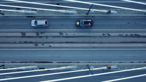 Looking-straight-down-onto-cable-stayed-bridge-with-vehicle-traffic