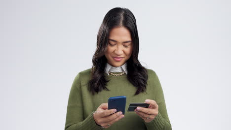 Woman, smartphone and credit card