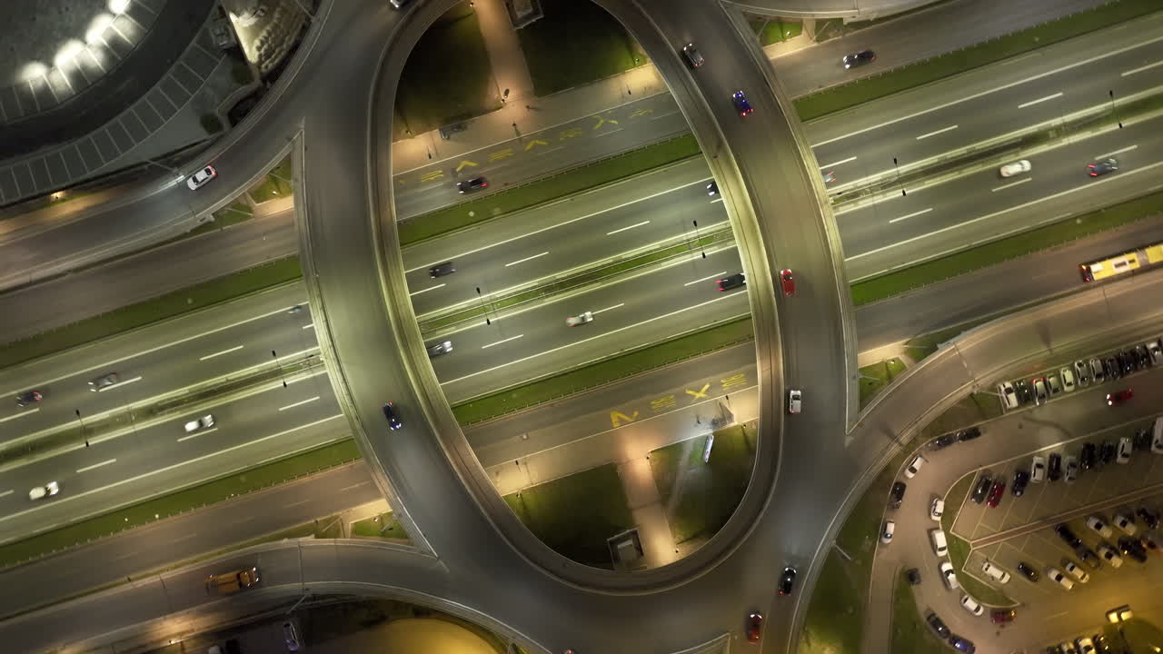 Aerial view of an illuminated highway interchange at night