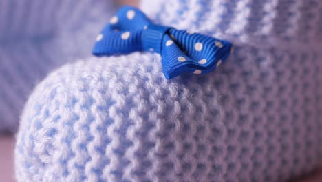 close-up of baby booties with bow