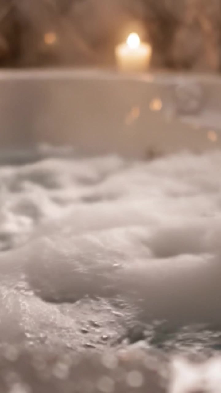 Relaxing Moments: A Serene Bath Experience with Bubbles, Soft Lighting, and Calm Water to Indulge in Self-Care and Tranquility After a Long Day
