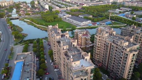 aerial orbits suzhou city tall buildings to reveal river canals below