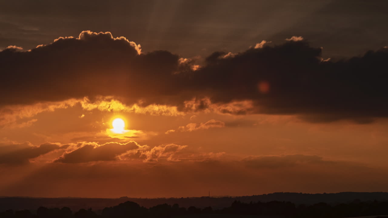 Clouds pass by in a time lapse of a glorious Sunset on a June evening over Worcestershire, England, UK