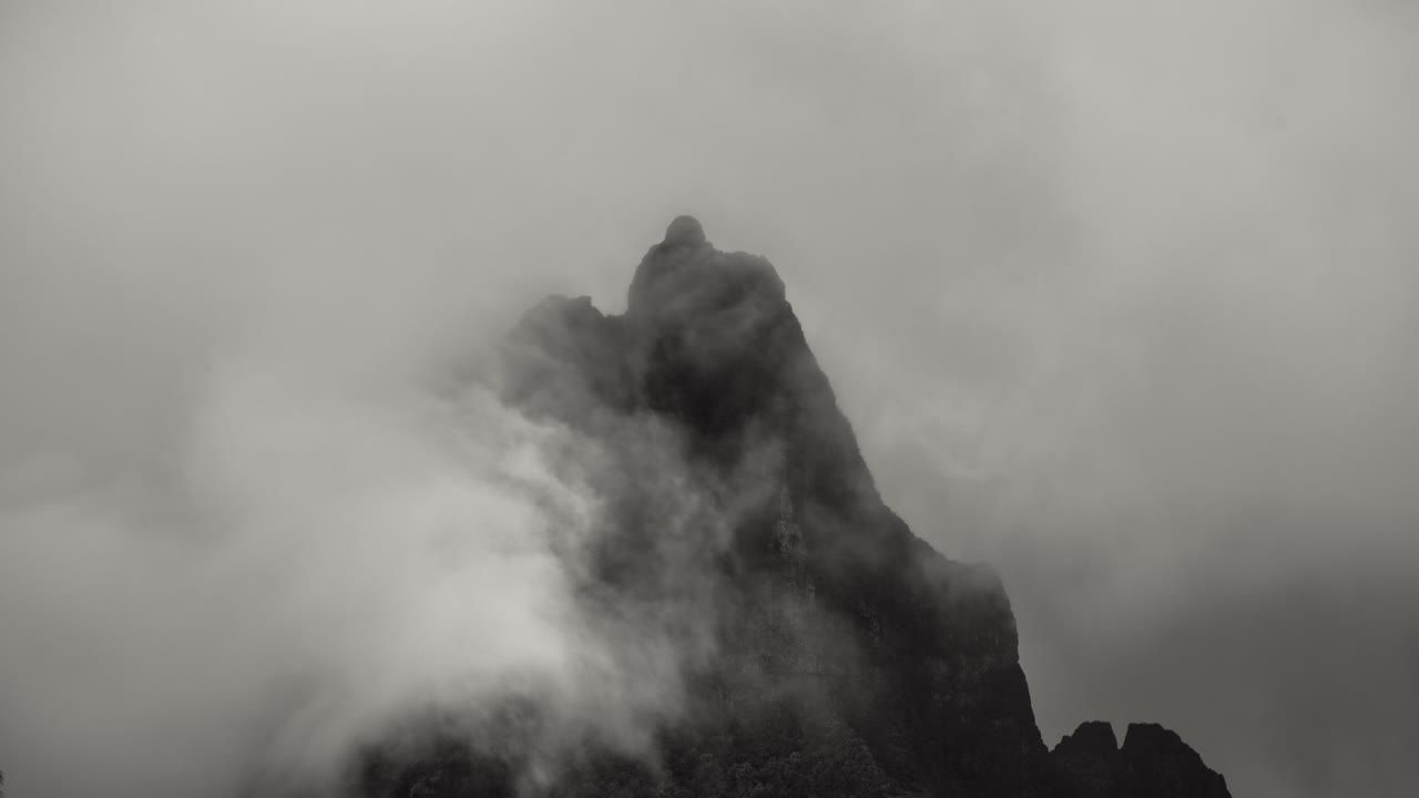 Timelapse Mt Rotui in Moorea, French Polynesia. Close up of clouds moving past mountain peak