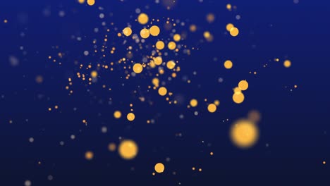 shimmering particles with bokeh over dark blue background.