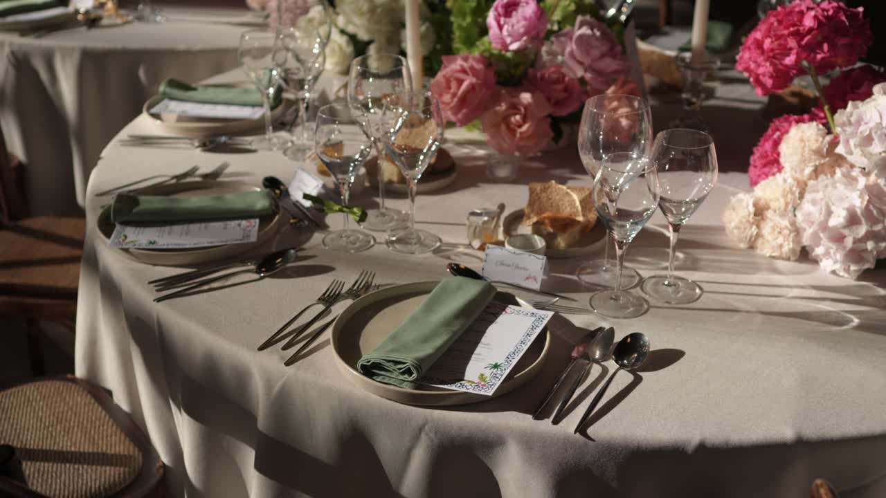 wedding table set with floral decor and soft lighting highlighting fine table arrangement