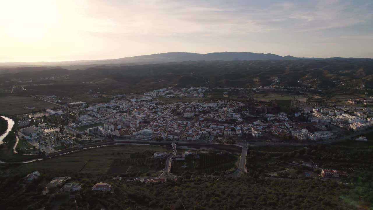 High rising aerial of the portuguese city Silves and the Arade river