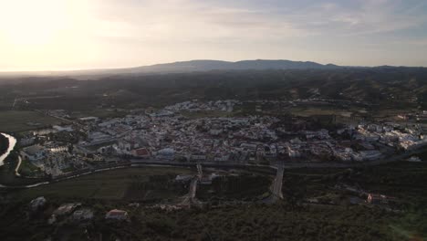 high rising aerial of the portuguese city silves and the arade river