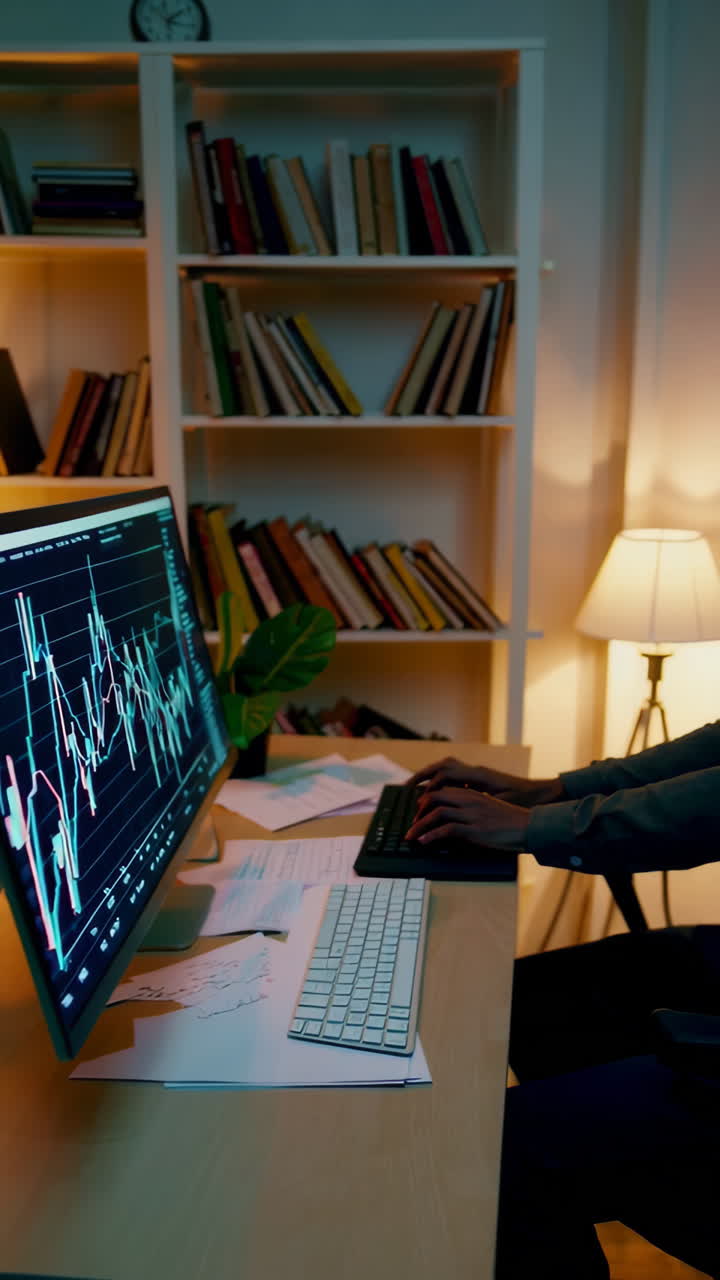 Person working on financial charts at night