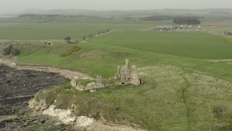 An-aerial-view-of-Newark-Castle-on-the-Fife-coastal-path,-Scotland