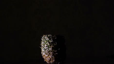 disassembling pineapple, ananas in the dark. time lapse