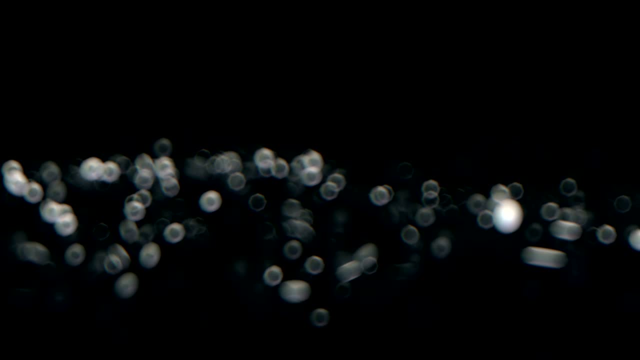 Animazione di alta qualità di uno sfondo natalizio astratto sfocato con luci bokeh sfocate. Loop continuo.