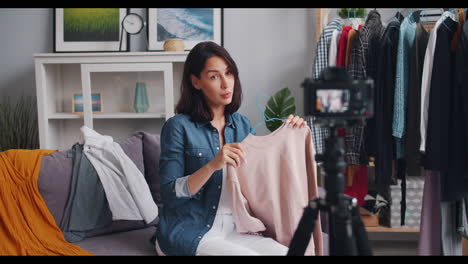 fashion blogger reviews a cozy pink sweater