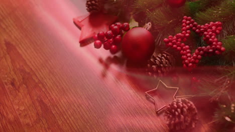 animation of christmas decorations and stars with copy space on red background