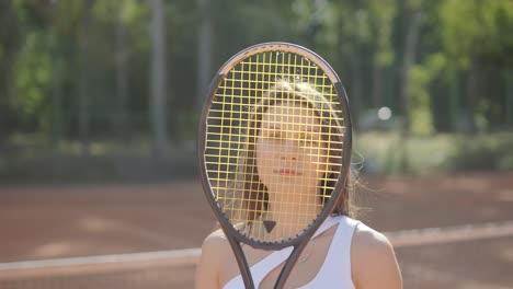 female tennis player practicing serve on outdoor court