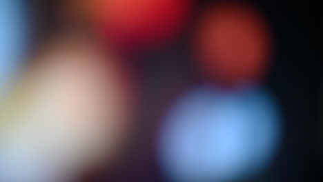 colorful bokeh background with red, orange, and white lights