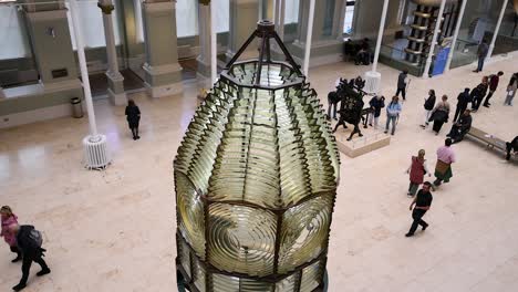 people exploring exhibits in museum hall