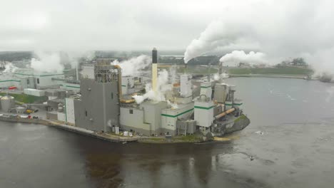 Static-aerial-shot-of-the-Irving-Pulp-Factory-shooting-toxic-smoke-into-the-air-next-to-the-reversing-falls-in-New-Brunswick