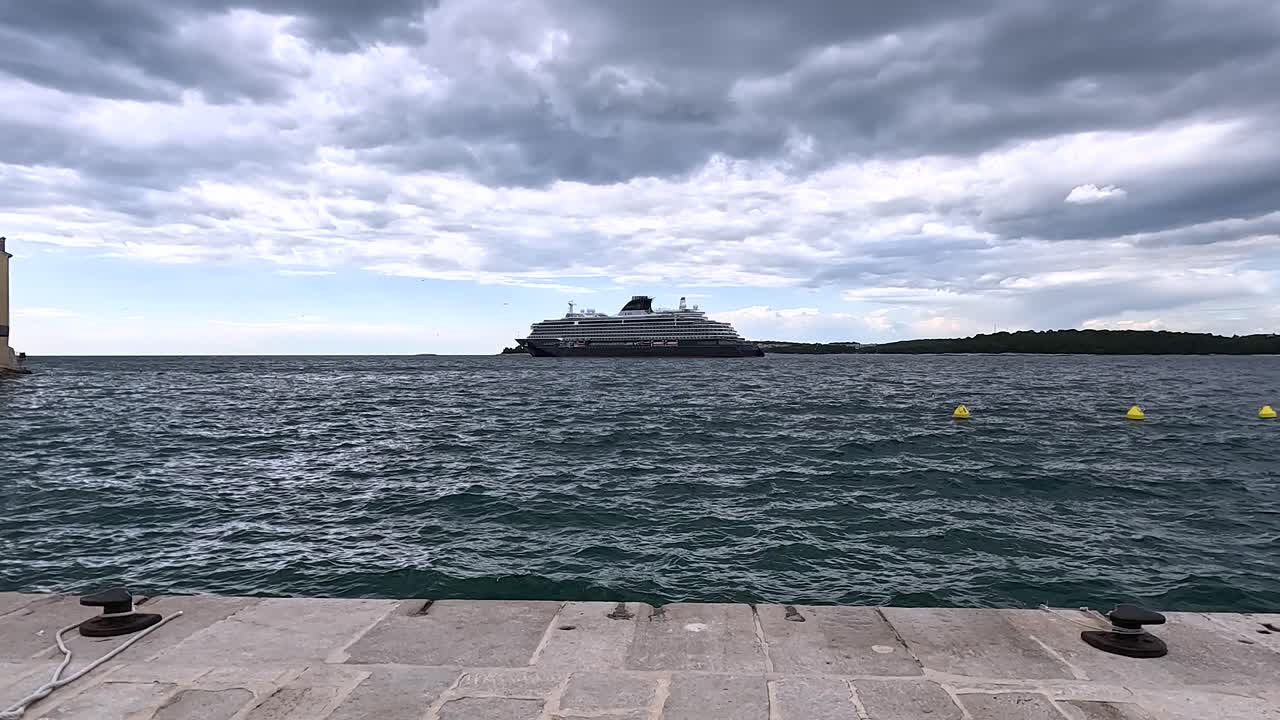 Cruise ship anchored in Rovinj harbor in Adriatic Sea, mediterranean boat tour, static