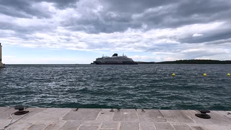 cruise ship anchored in rovinj harbor in adriatic sea, mediterranean boat tour, static