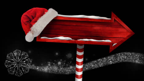 animation of wooden sign with santa hat over snow falling at christmas