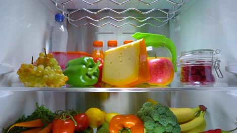 Open-refrigerator-filled-with-food