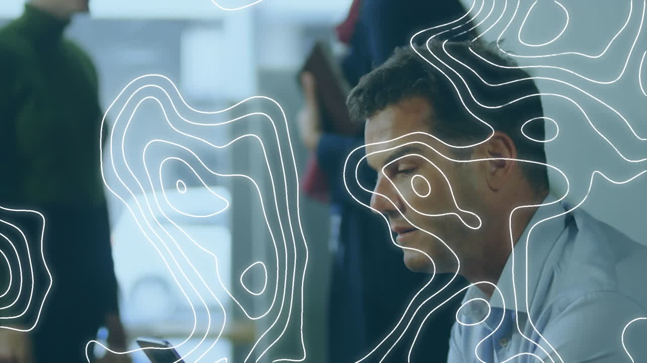 Topography pattern against caucasian businessman using smartphone at office