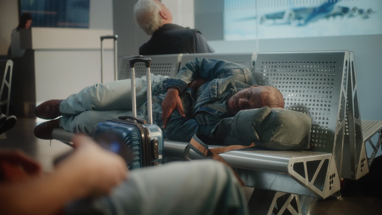 Tired traveler sleeping in airport lounge