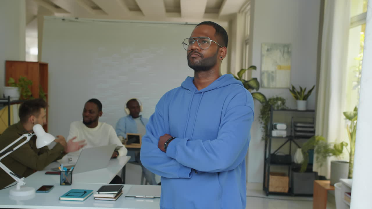 Asian Project Manager in Blue Hoodie Posing at Startup Office