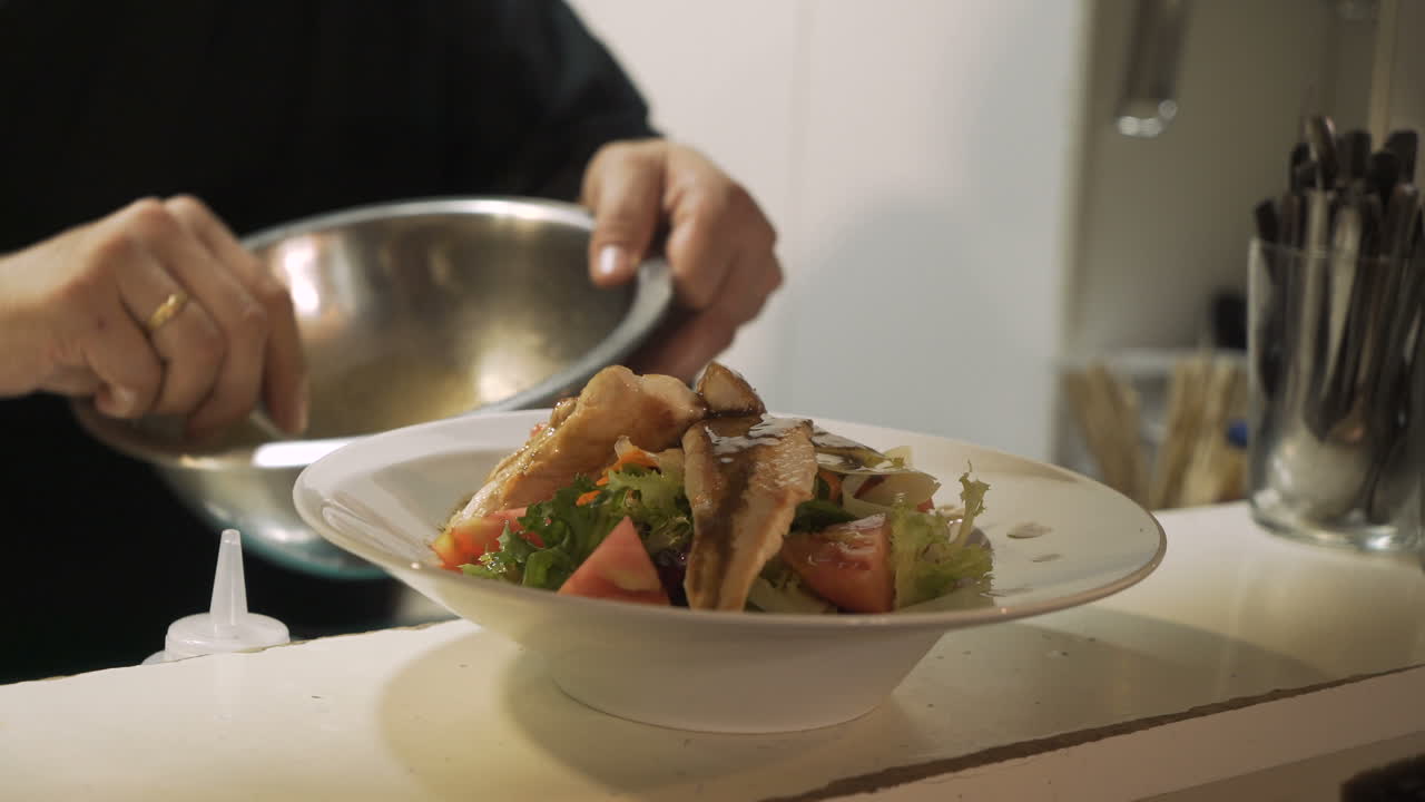 Chef preparing a gourmet salmon salad