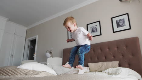 Jumping-off-of-happiness-on-the-bed-looking-at-flying-soap-bubbles