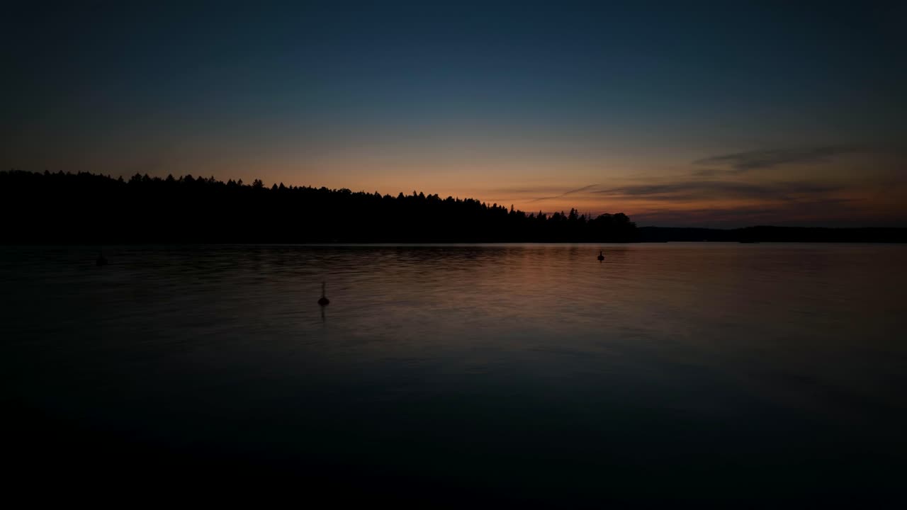 Peaceful sunset over Stockholm Archipelago with calm waters and vibrant sky