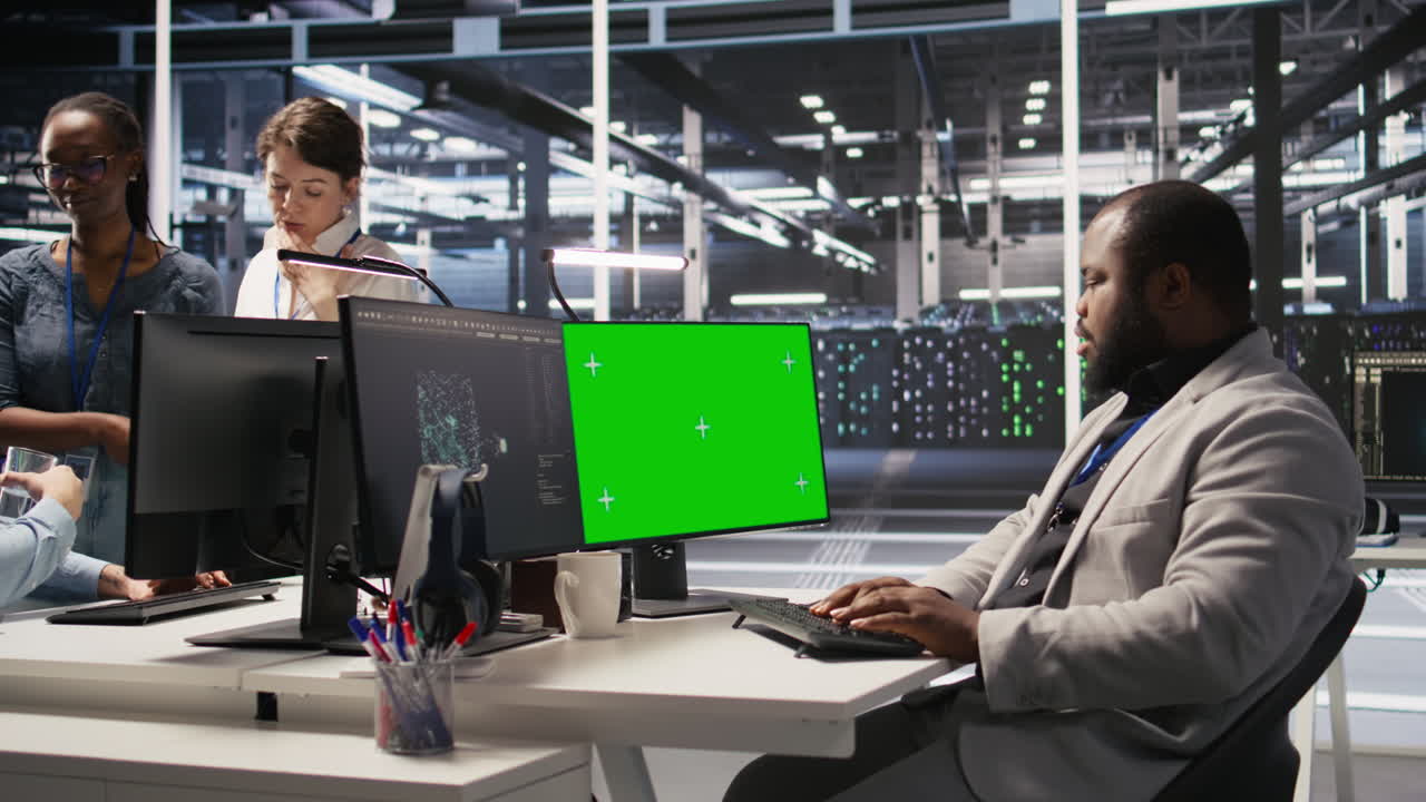 Vertical video Data center admin inspecting gear using green screen mockup PC