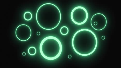 Pulsating-green-neon-rings-in-various-sizes-glowing-on-black-background-and-tilting