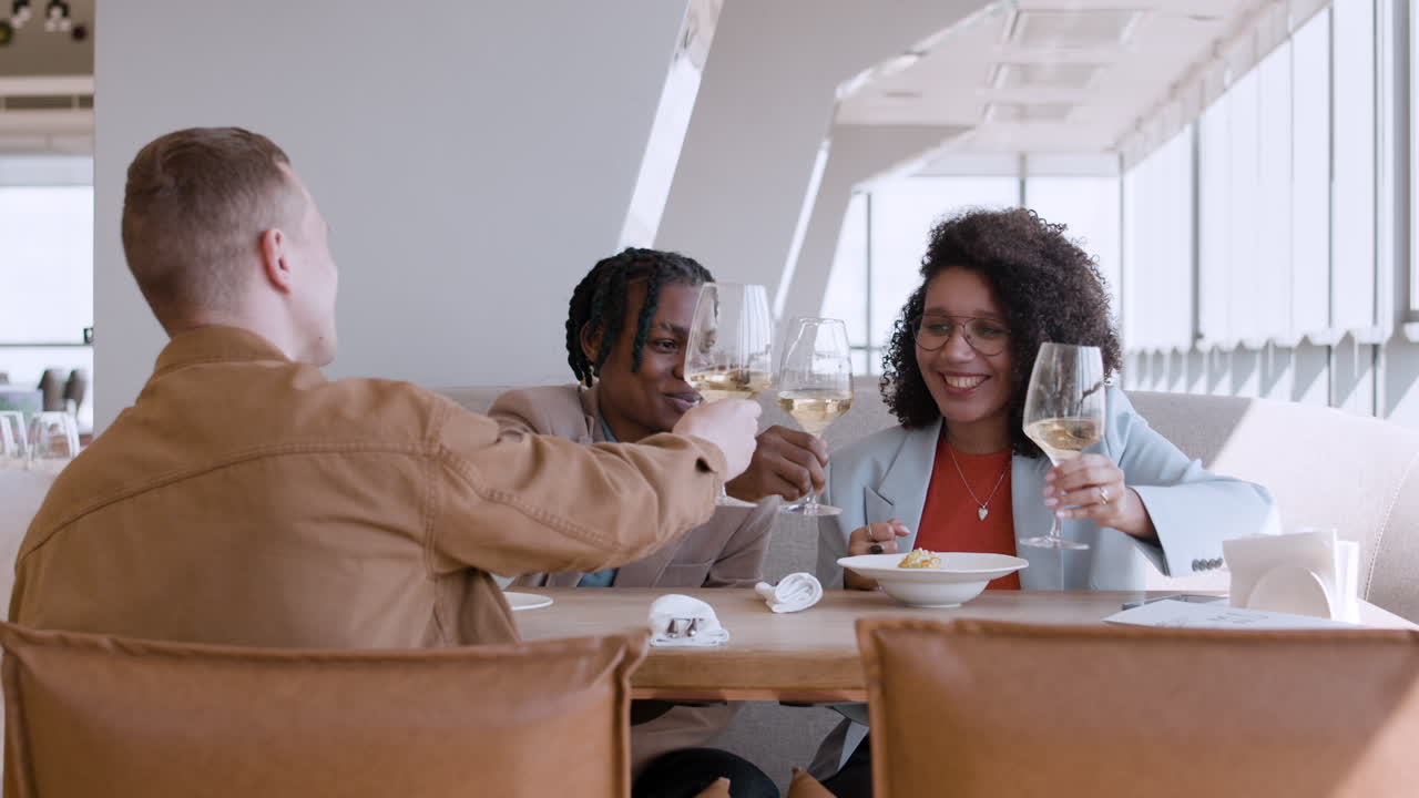 Friends Celebrating in a Modern Restaurant