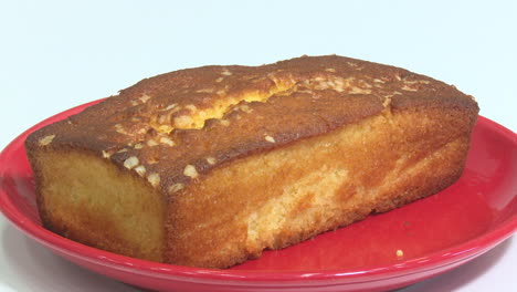 a loaf of cake on a red plate