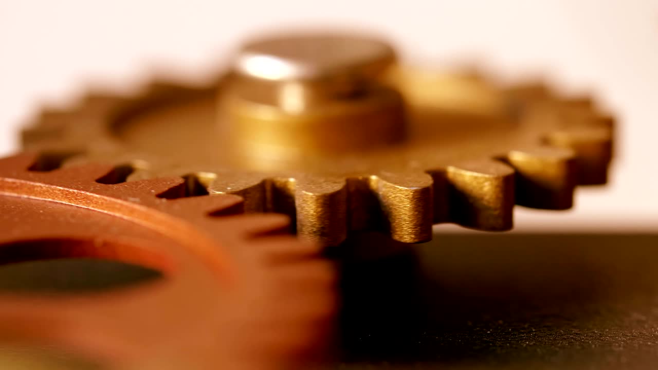 clock wheels mechanism: wheels beating time- close up