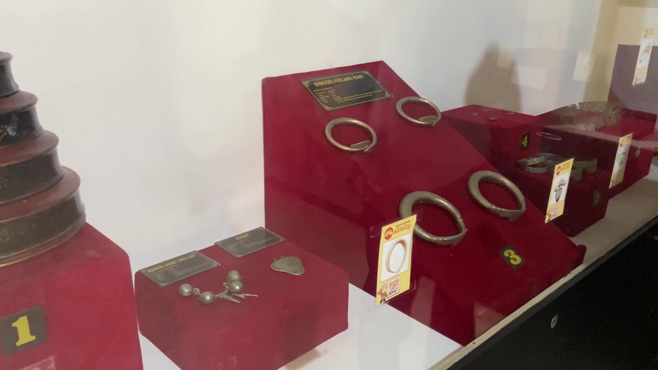 Display of Traditional Indonesian Anklets and Cultural Artifacts in Museum