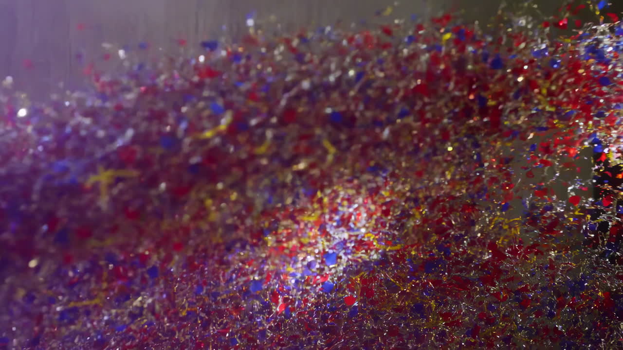Vibrant Confetti Particles Swirling and Exploding